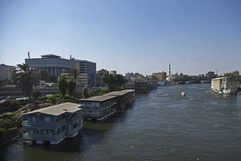 The houseboat belonging to Ikhlas Helmy and others stand moored on the River Nile on June 27, 2022. A government push to remove the string of houseboats from Cairo’s Nile banks has dwindled their numbers from a several dozen to just a handful. Helmy stands to evicted, and the boat moved or demolished. The tradition of living on the Nile River dates back to the 1800s, and the removal of the boats has drawn criticism in Egypt. The government says it plans to develop the waterfront. (AP Photo/Tarek Wagih)