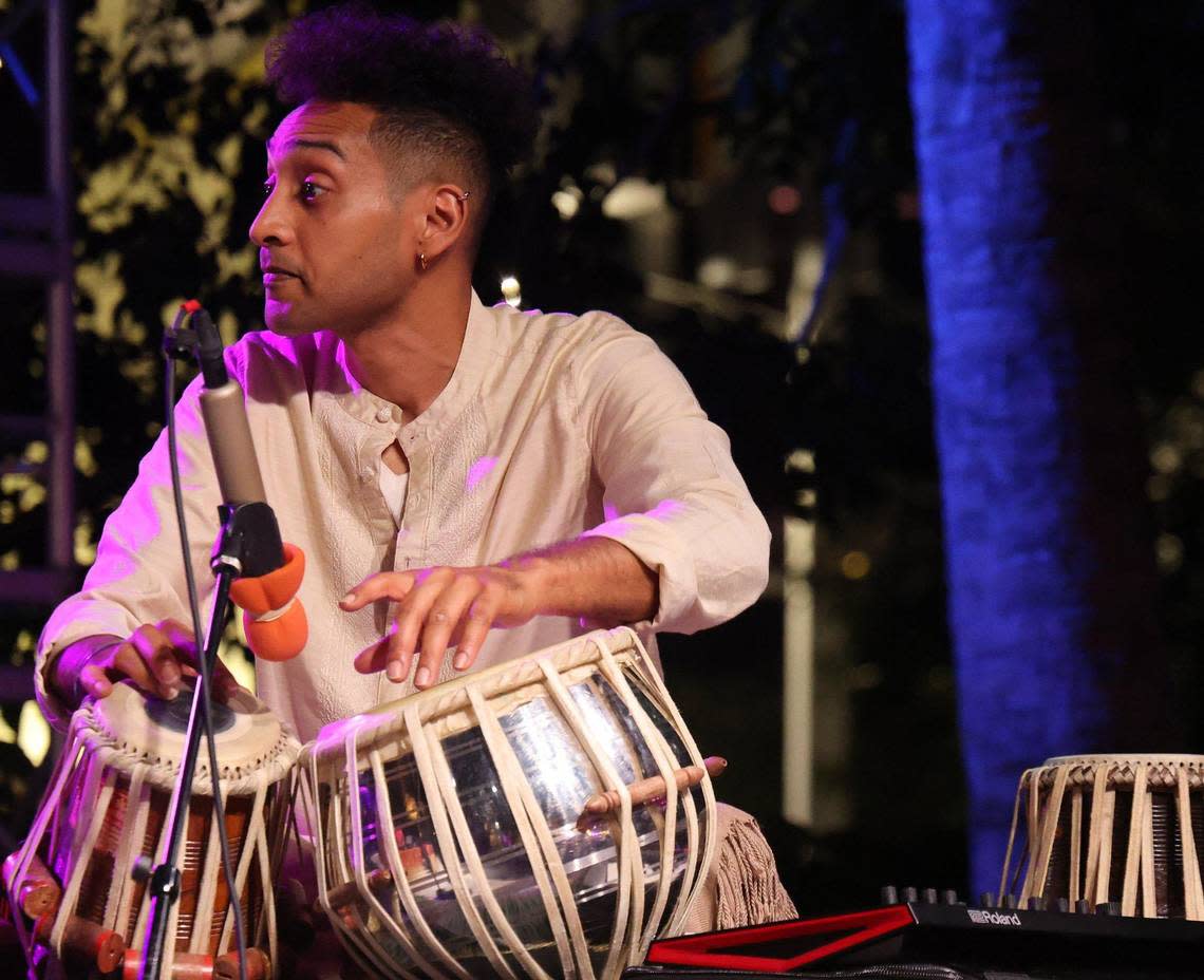 A drummer accompanies the DJ while beating on the traditional drums called the tabla as South Florida's Hindi community celebrated the “Festival of Lights” during the Diwali Miami event at Oasis Wynwood.