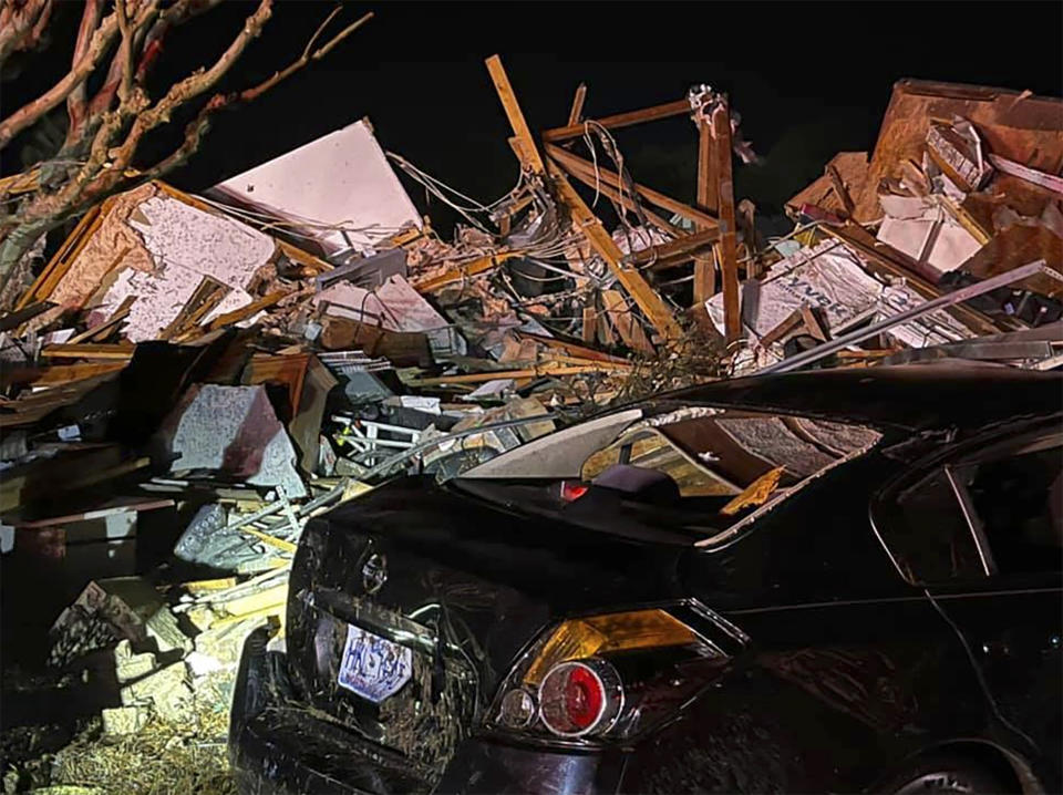 A damaged vehicle sits among debris after a deadly tornado tore through Brunswick County, N.C., Tuesday, Feb. 16, 2021. North Carolina authorities say multiple people are dead and others were injured after a tornado ripped through Brunswick County, leaving a trail of heavy destruction. (Emily Flax/Brunswick County Sheriff’s Office via AP)