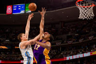 DENVER, CO - MAY 10: Timofey Mozgov #25 of the Denver Nuggets shoots over Andrew Bynum #17 of the Los Angeles Lakers in Game Six of the Western Conference Quarterfinals in the 2012 NBA Playoffs at Pepsi Center on May 10, 2012 in Denver, Colorado. The Nuggets defeated the Lakers 113-96. NOTE TO USER: User expressly acknowledges and agrees that, by downloading and or using this photograph, User is consenting to the terms and conditions of the Getty Images License Agreement. (Photo by Justin Edmonds/Getty Images)