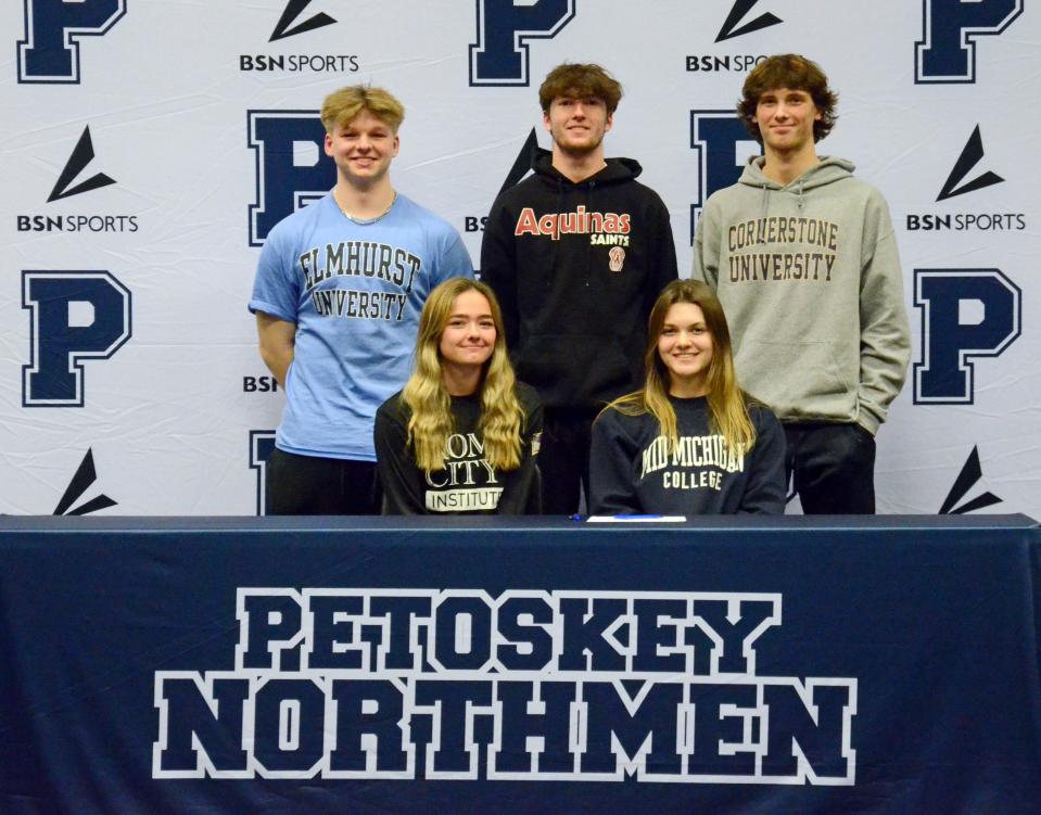 Petoskey athletes (back, from left)) Joe McCarthy, Brandon Klingelsmith, Jaden VanderWall (bottom, from left) Lucy Tarachas and Jaidyn Ecker all made things official to continue their athletic careers Wednesday on National Signing Day in a ceremony held at Petoskey High School.