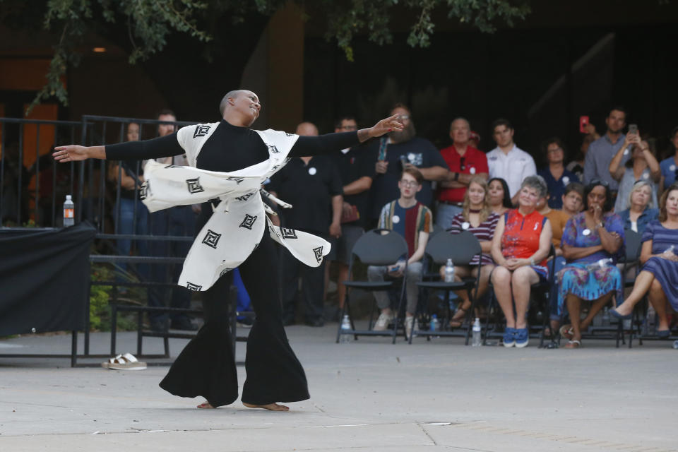 Dancer Maisha Morris dances during a memorial prayer service, Sunday, Sept. 1, 2019, in Odessa, Texas, for the victims of a shooting spree the day before. (AP Photo/Sue Ogrocki)