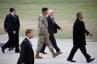 U.S. Vice President Mike Pence walks with Commander General Vincent K. Brooks as he arrives at Camp Bonifas near the truce village of Panmunjom, in Paju, South Korea, April 17, 2017. REUTERS/Kim Hong-Ji