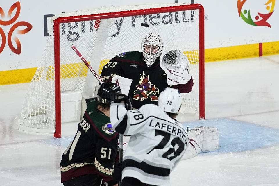 Arizona Coyotes goaltender Connor Ingram (39) stops a shot by Los Angeles Kings right wing Alex Laferriere (78) during the third period of an NHL hockey game, Monday, Nov. 20, 2023, in Tempe, Ariz. (AP Photo/Matt York)