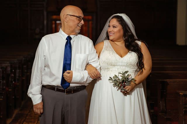 <p>Nuva Photography</p> Julio Fonseca walking his daughter Ruthie Fonseca down the aisle.