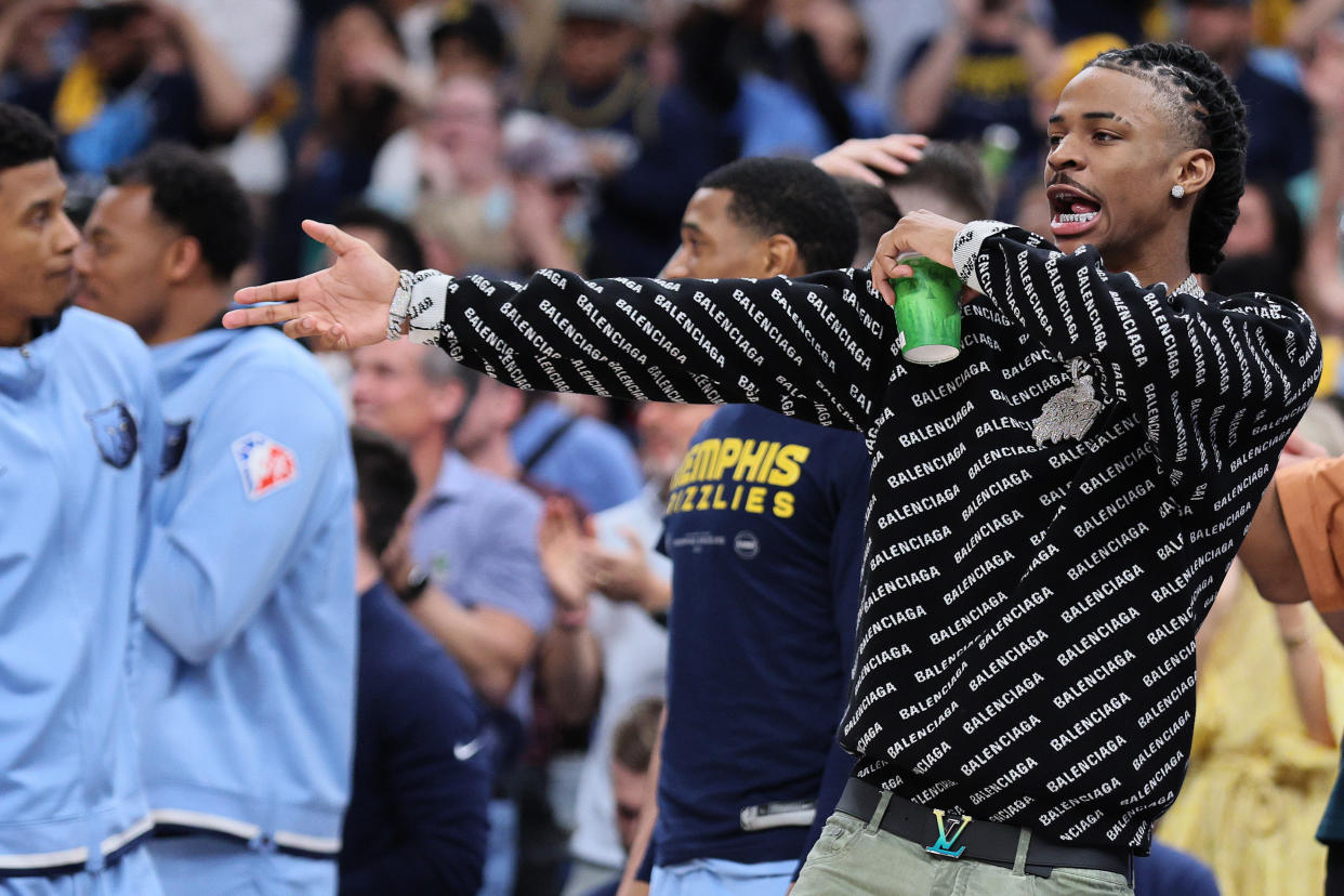 MEMPHIS, TENNESSEE - MAY 11: Ja Morant #12 of the Memphis Grizzlies reacts from the bench against the Golden State Warriors during the third quarter in Game Five of the 2022 NBA Playoffs Western Conference Semifinals at FedExForum on May 11, 2022 in Memphis, Tennessee. NOTE TO USER: User expressly acknowledges and agrees that, by downloading and/or using this photograph, User is consenting to the terms and conditions of the Getty Images License Agreement. (Photo by Andy Lyons/Getty Images)