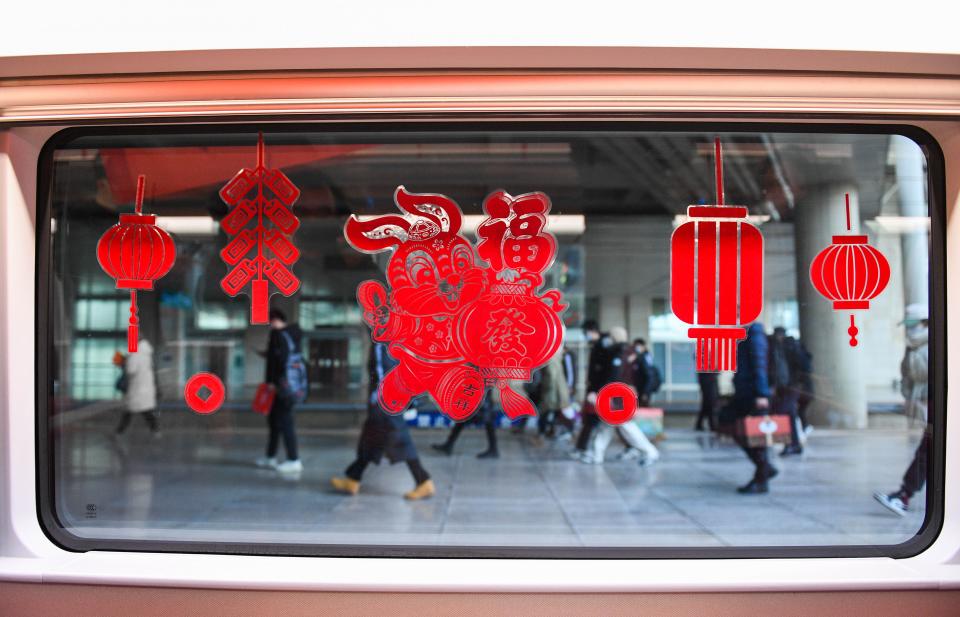 Decorations adorn the Fuxing bullet train G2457, which travels from Beijing to Hohhot, at Hohhot East Railway Station in Hohhot, Jan. 14, 2023.<span class="copyright">Liu Lei—Xinhua/Getty Images</span>