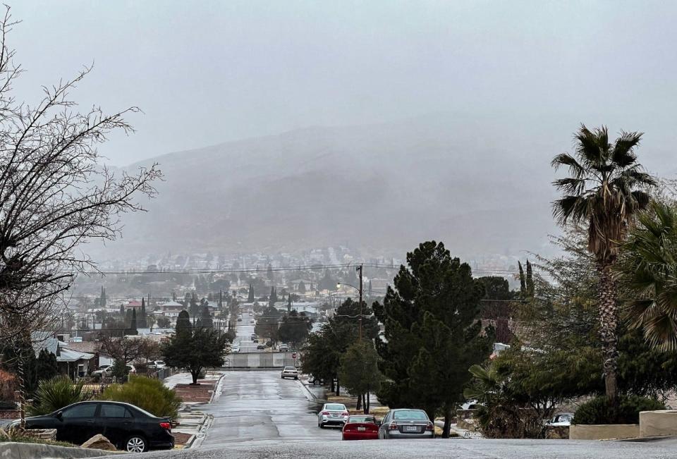 Rain wet El Paso streets on Jan. 3 as snow fell on the area mountains. Inclement weather also was forecast for Tuesday morning, impacting area school districts.