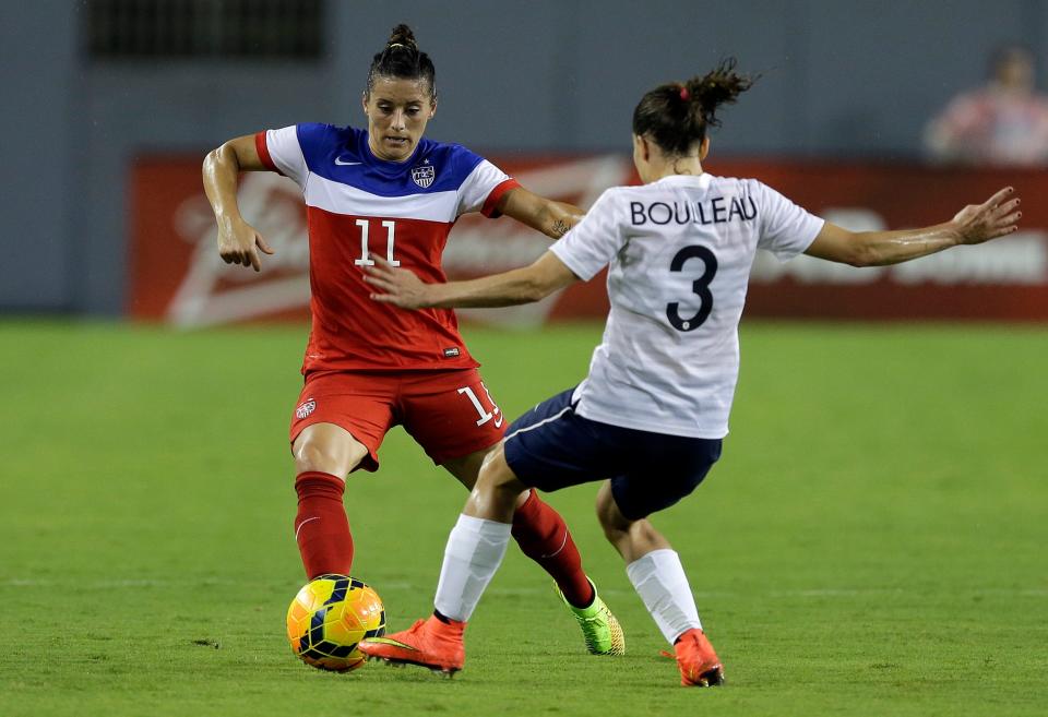 Ali Krieger controls the ball against France.