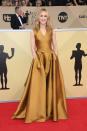 <p>The 59-year-old actress wore a floor-length bronze pleated dress. (Photo: Getty Images) </p>