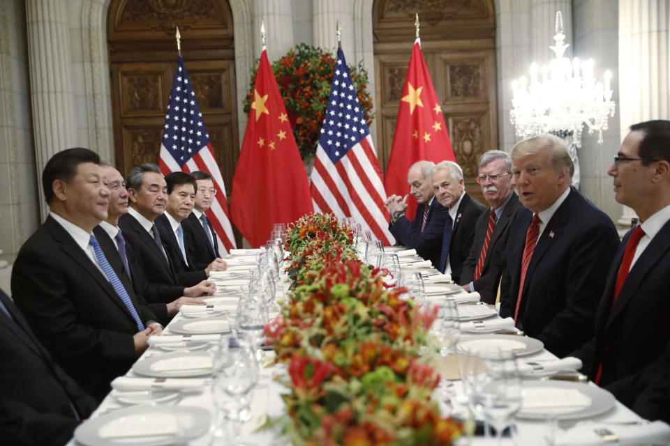 FILE - In this Dec. 1, 2018, file photo, U.S. President Donald Trump, second right, meets with China's President Xi Jinping, left, during their bilateral meeting at the G20 Summit, in Buenos Aires, Argentina. Chinese and U.S. trade negotiators are in contact on ways of resolving disputes ahead of an expected meeting between their heads of state at the G-20 summit in Japan later this week, a Chinese official said Monday, June 24, 2019. (AP Photo/Pablo Martinez Monsivais, File)