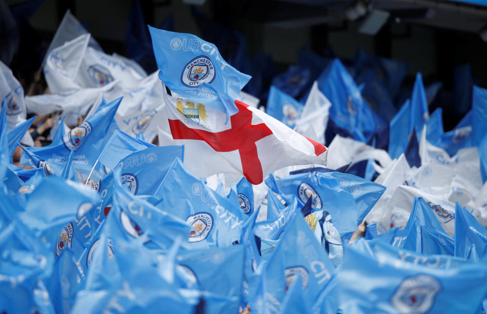 <p>Soccer Football – Premier League – Manchester City vs Huddersfield Town – Etihad Stadium, Manchester, Britain – May 6, 2018 General view as fans wave flags before the match Action Images via Reuters/Carl Recine EDITORIAL USE ONLY. No use with unauthorized audio, video, data, fixture lists, club/league logos or “live” services. Online in-match use limited to 75 images, no video emulation. No use in betting, games or single club/league/player publications. Please contact your account representative for further details. </p>