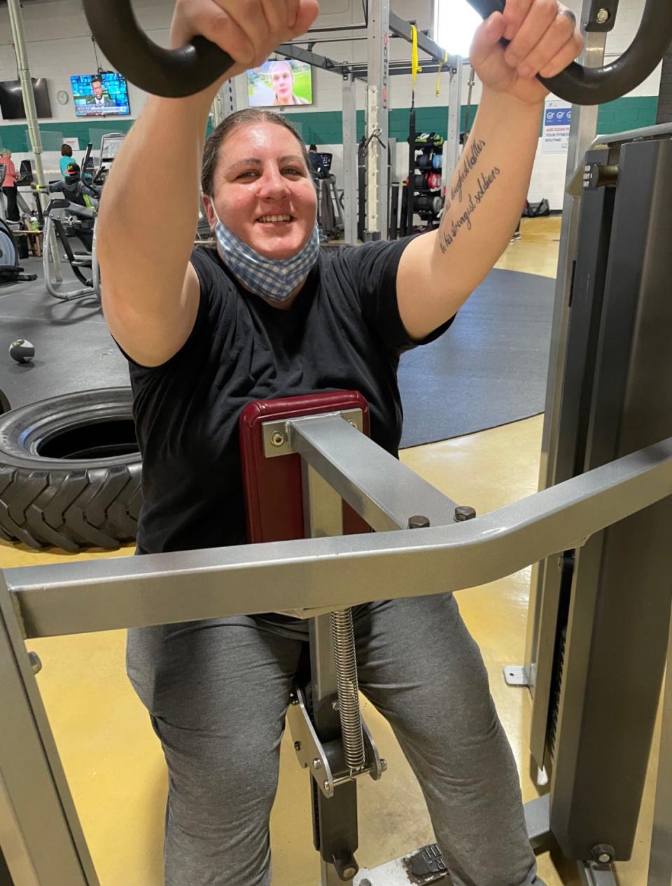 Cancer survivor Angela Gross completes arm exercises during an Old Colony YMCA Livestrong program