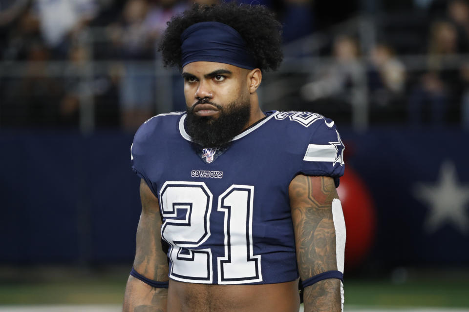 FILE - In this Dec. 15, 2019, file photo, Dallas Cowboys running back Ezekiel Elliott (21) warms up before an NFL football game against the Los Angeles Rams in Arlington, Texas. Ezekiel Elliott tested positive for the coronavirus, according to his agent. Rocky Arceneaux told the NFL Network on Monday, June 15, 2020, that Elliott was feeling OK and recovering.(AP Photo/Roger Steinman, FIle)