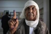 A man shows his ink-marked finger after voting in the municipal election at a polling station in Benghazi April 19, 2014. REUTERS/Esam Omran Al-Fetori