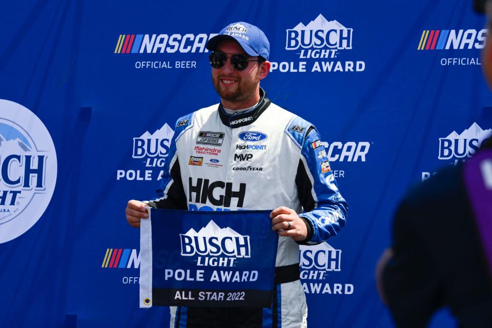 Chase Briscoe celebrates after winning the pole for the Enjoy Illinois 300 at World Wide Technology Raceway.