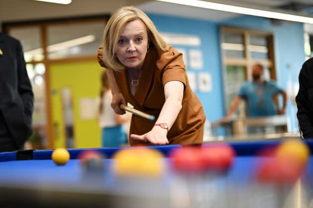 Liz Truss plays pool during a visit to Chelmsford. (Photo: Pool via Getty Images)