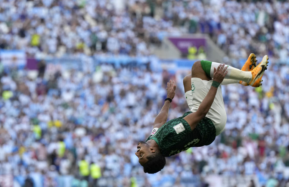 FILE - Saudi Arabia's Salem Al-Dawsari celebrates after scoring his side's second goal during the World Cup group C soccer match between Argentina and Saudi Arabia at the Lusail Stadium in Lusail, Qatar, on Nov. 22, 2022. For a brief moment after Saudi Arabia's Salem Aldawsari fired a soccer ball from just inside the penalty box into the back of the net to seal a win against Argentina, Arabs across the divided Middle East found something to celebrate. (AP Photo/Ricardo Mazalan, File)