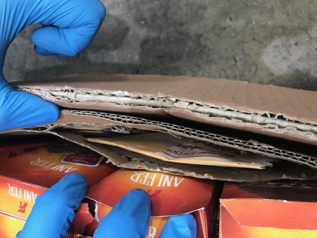 An envelope of heroin concealed in a cardboard box containing a shipment of fruit and nuts at Heathrow Airport: Border Force