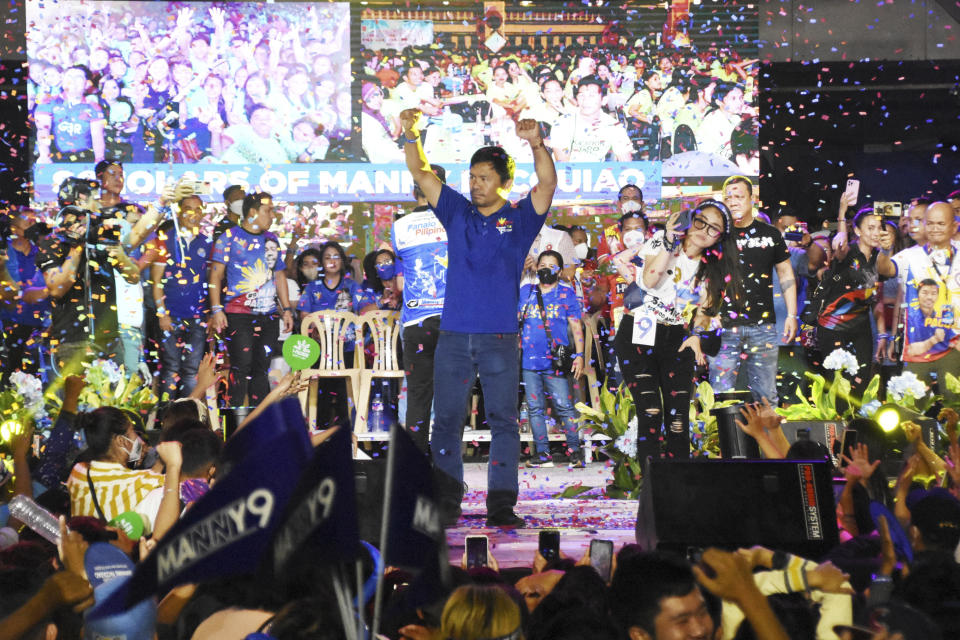 Presidential candidate and boxing legend, Senator Manny "Pacman" Pacquiao gestures to the crowd during their last campaign rally known as "Miting De Avance" on Saturday, May 7, 2022 in General Santos city, southern Philippines. About 67 million registered Filipino voters will pick a new president on Monday, with Ferdinand Marcos, Jr, son and namesake of the ousted dictator leading pre-election surveys, and incumbent Vice President Leni Robredo, who leads the opposition, as his closest challenger. (AP Photo)