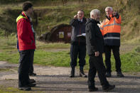 Members of a public inquiry into the feasibility of a proposed new coal mine make a visit to the site near the town of Whitehaven in northwest England, Monday, Oct. 4, 2021. (AP Photo/Jon Super)