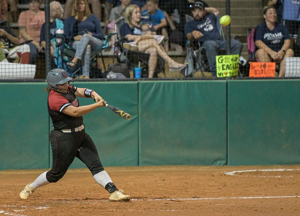 Middleburg’s Belle Mincey (21) hits a home run during Friday's Class 5A state championship game against South Lake at Legends Way Ball Fields in Clermont.