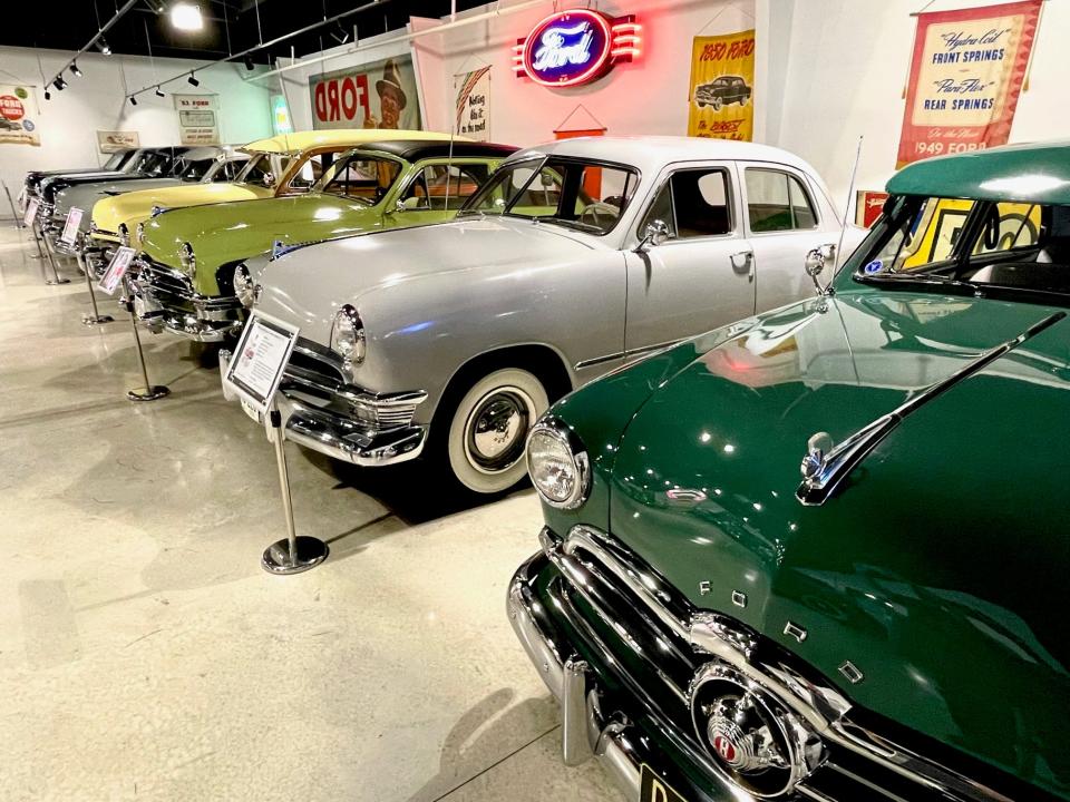 This rainbow of classic Fords is one of many displays at the Ford museum.