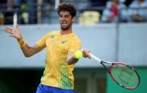 2016 Rio Olympics - Tennis - Quarterfinal - Men's Singles Quarterfinals - Olympic Tennis Centre - Rio de Janeiro, Brazil - 12/08/2016. Thomaz Bellucci (BRA) of Brazil in action against Rafael Nadal (ESP) of Spain. REUTERS/Kevin Lamarque