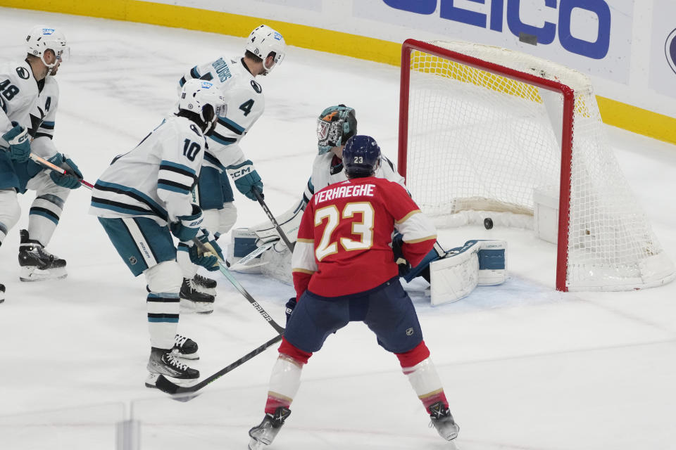 Florida Panthers center Carter Verhaeghe (23) scores a goal against San Jose Sharks goaltender Mackenzie Blackwood (29) during the second period of an NHL hockey game, Tuesday, Oct. 24, 2023, in Sunrise, Fla. (AP Photo/Marta Lavandier)