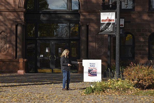 A woman drops off a ballot in Fargo, North Dakota