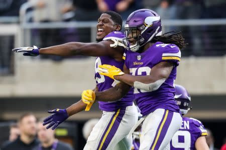 FILE PHOTO: Dec 16, 2018; Minneapolis, MN, USA; Minnesota Vikings cornerback Xavier Rhodes (29) celebrates with running back Dalvin Cook (33) during the fourth quarter against the Miami Dolphins at U.S. Bank Stadium. Mandatory Credit: Brace Hemmelgarn-USA TODAY Sports