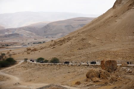 A convey drives off after Israeli Prime Minister Benjamin Netanyahu held a weekly cabinet meeting in the Jordan Valley, in the Israeli-occupied West Bank