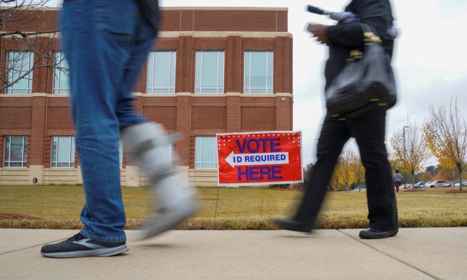 Voters line up to cast their ballots for the Georgia runoff election.