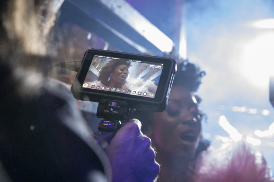 Branjae appears in a behind-the-scenes photo during the making of her music video "Too Much."
