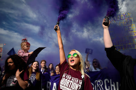 Demonstrators let off flares during a march for more liberal Irish abortion laws, in Dublin, Ireland September 30, 2017. REUTERS/Clodagh Kilcoyne