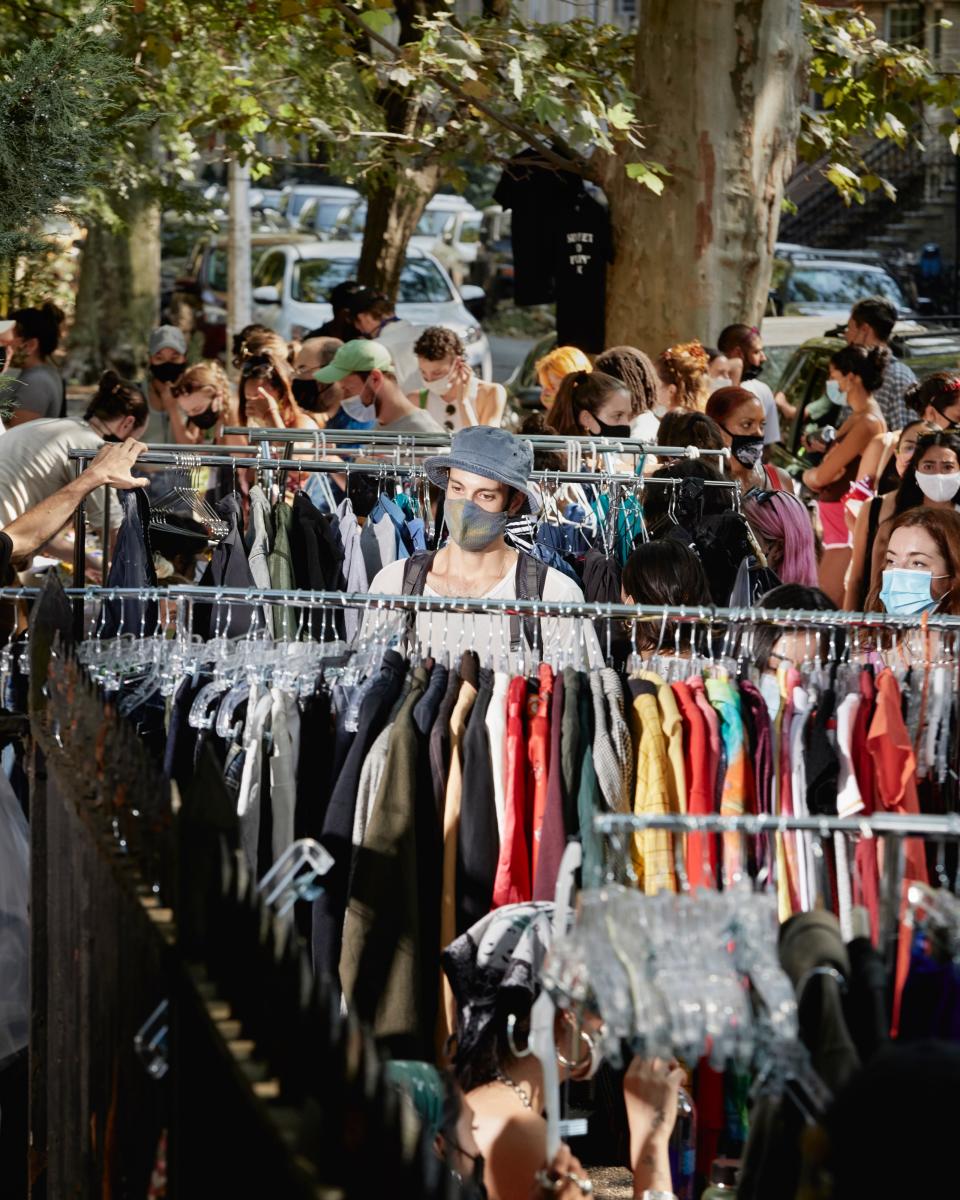 Brooklyn, NY - August 9, 2020A shopper browses clothes for sale at the "Black Lives Matter Sidewalk Sale", a fundraising event that has taken place at on Sundays at McGolrick Park since early June.