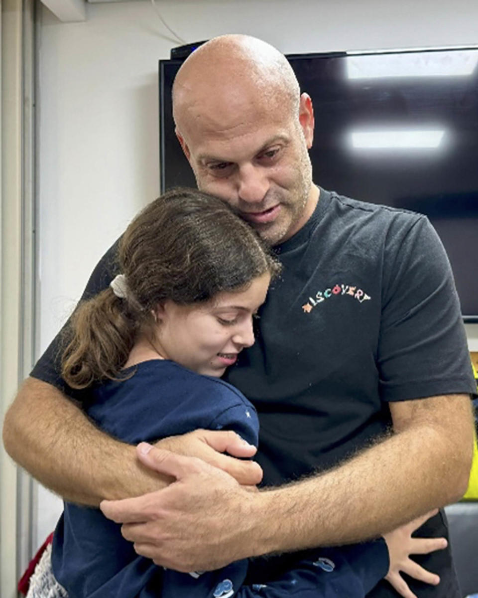 Image: Hila Rotem Shoshani, a released hostage, reunites with her uncle (Israeli army via AP)