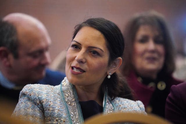 Dame Priti Patel sits in the audience at a Popular Conservatism event