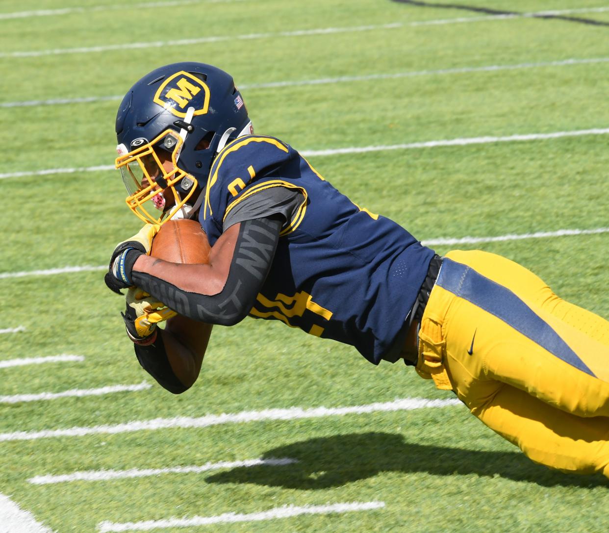 Jordan Marshall makes an acrobatic catch on the sidelines to keep a Moeller drive alive against St. Ignatius at Schueler Field, Mount St. Joseph University Stadium, Oct. 7, 2023.