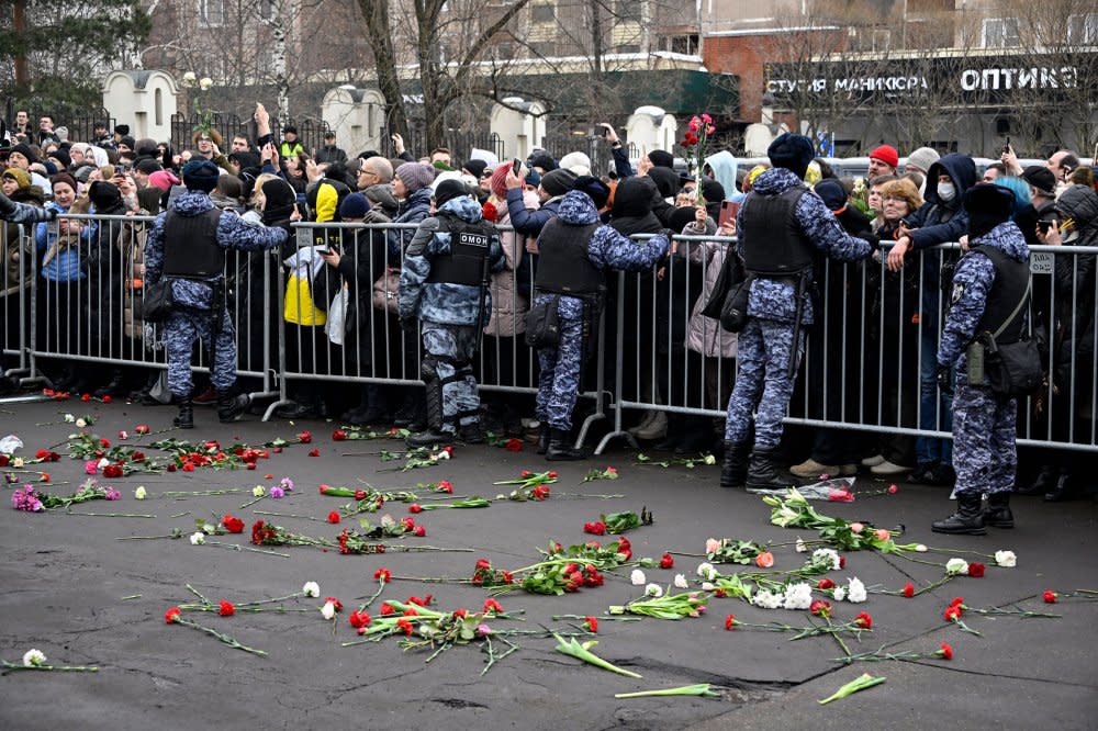 Mourners react as the hearse carrying the coffin of late Russian opposition leader Alexei Navalny leaves the Mother of God Quench My Sorrows church towards the Borisovo cemetery for Navalny's burial, in Moscow's district of Maryino on March 1, 2024.<span class="copyright">Alexander Nemenov—AFP/Getty Images</span>