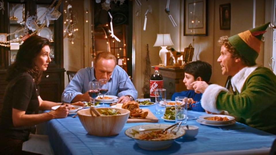 Buddy eating dinner with his human family