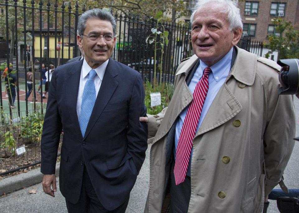 Former Goldman Sachs and Procter & Gamble Co. board member Rajat Gupta, left, arrives outside federal court in New York Wednesday, Oct. 24, 2012. Gupta is to be sentenced after being found guilty insider trading by passing secrets between March 2007 and January 2009 to a billionaire hedge fund founder who used the information to make millions of dollars. At right is Gupta's attorney Gary Naftalis. (AP Photo/Craig Ruttle)