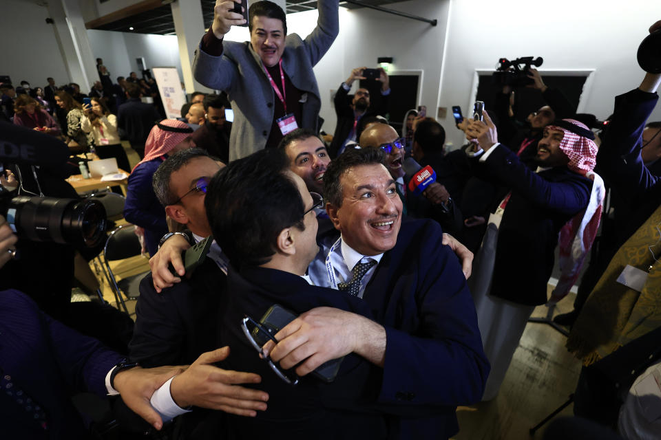 Members of the Saudi Arabia delegation react as the Bureau International des Expositions, or BIE, announces the vote Tuesday, Nov. 28, 2023 in Issy-les-Moulineaux, outside Paris. Saudi Arabia's capital Riyadh was chosen to host the 2030 World Expo, beating out South Korean port city Busan and Rome for an event expected to draw millions of visitors. Saudi Arabia's capital Riyadh was chosen on Tuesday to host the 2030 World Expo, beating out South Korean port city Busan and Rome for an event expected to draw millions of visitors. Riyadh was picked by a majority of 119 out of 165 votes by the member states. (AP Photo/Aurelien Morissard)
