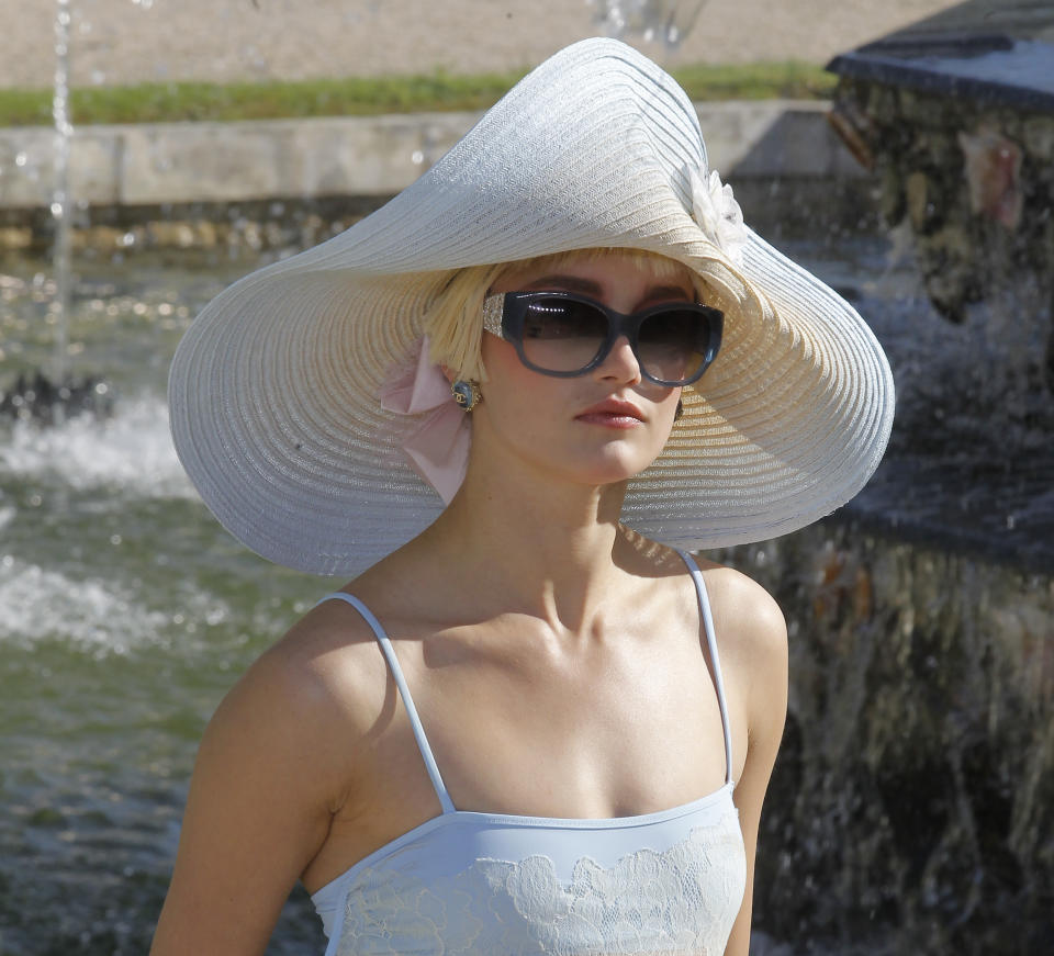 A model presents a creation by German fashion designer Karl lagerfeld for Chanel, Monday, May, 14, 2012. Master of Fashion, Karl Lagerfeld spares no expenses for his midseason Chanel Cruise show offering held at the former home of Marie Antoinette, the Chateau de Versailles, southwest of Paris. (AP Photo/Jacques Brinon)