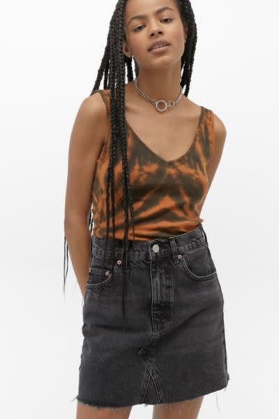 <p><strong>BDG</strong></p><p>urbanoutfitters.com</p><p><strong>$54.00</strong></p><p><a href="https://go.redirectingat.com?id=74968X1596630&url=https%3A%2F%2Fwww.urbanoutfitters.com%2Fshop%2Fbdg-austin-notched-black-denim-mini-skirt&sref=https%3A%2F%2Fwww.goodhousekeeping.com%2Fbeauty%2Ffashion%2Fg32729955%2Fjean-skirt-outfits%2F" rel="nofollow noopener" target="_blank" data-ylk="slk:Shop Now;elm:context_link;itc:0;sec:content-canvas" class="link ">Shop Now</a></p><p>A classic five pocket mini skirt style with raw hem detailing pairs well with any solid or printed tank top. Add a chain necklace to give it a little edge.</p>