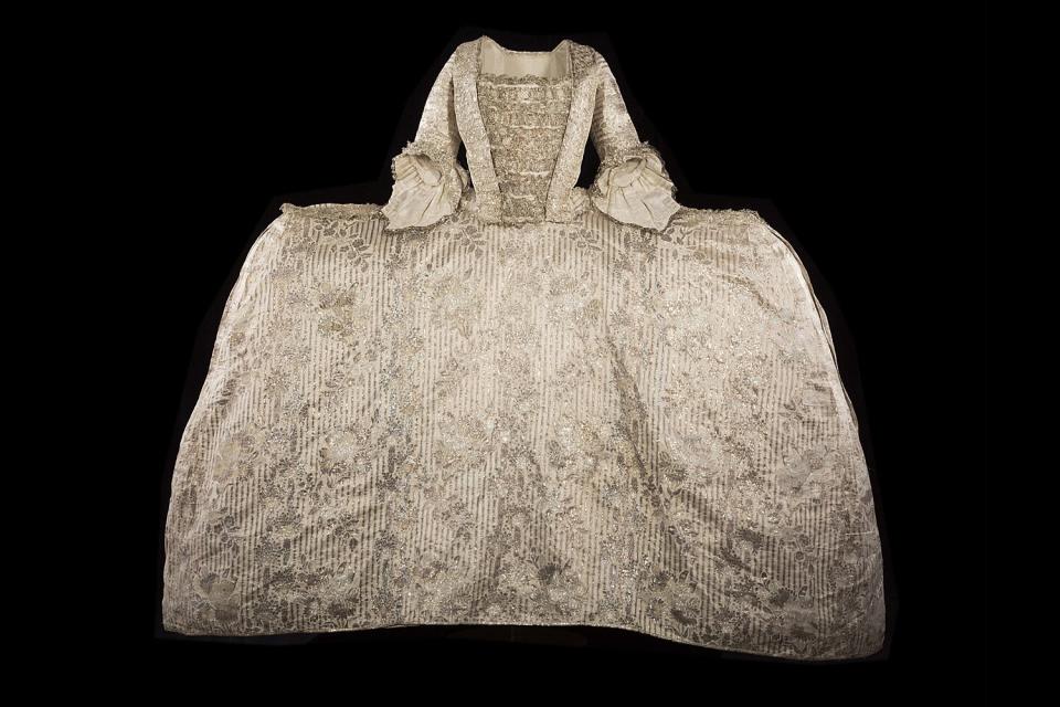 The Rockingham mantua. Silk satin brocaded in silver thread with silver lace trim. Probably worn by Mary, Marchioness of Rockingham, wife of British Prime Minister Charles Watson-Wentworth, 2nd Marquess of Rockingham