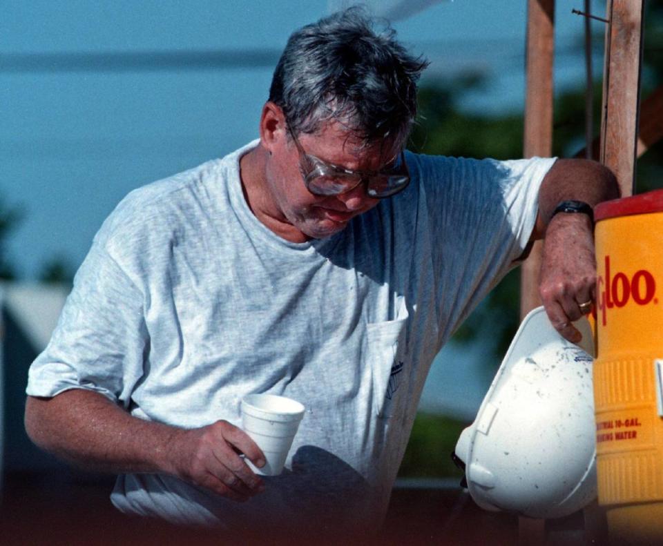 Broward.......10/17/97............photo mike stocker.........Senator Bob Graham takes a drink of water while working construction at McNicol Middle School. MIke Stocker/MHS