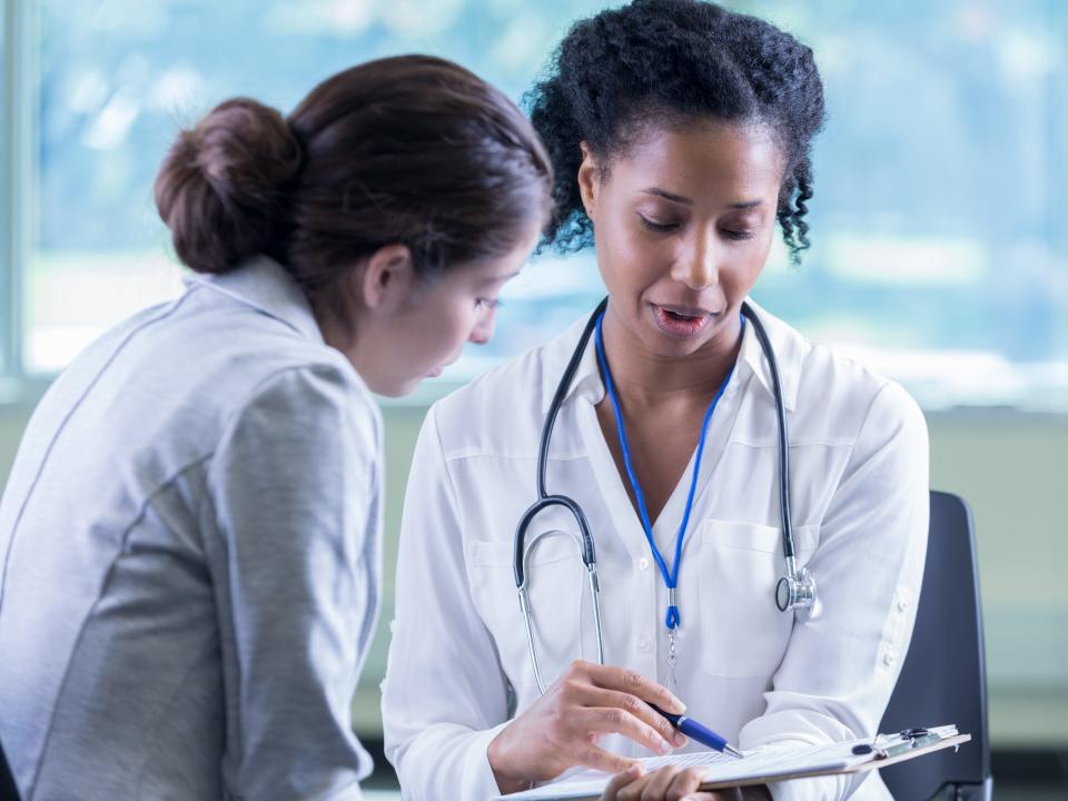 A stock image of a female African American doctor.