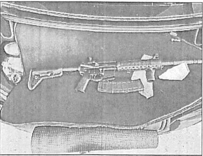 <em>Photo of a rifle attached to criminal complaint. (DOJ)</em>