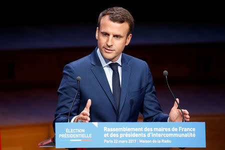 Emmanuel Macron, head of the political movement En Marche ! (or Onwards !) and candidate for the 2017 presidential election, delivers his speech at the Association of the Mayors of France (AMF) conference in Paris, France, March 22, 2017. REUTERS/Charles Platiau